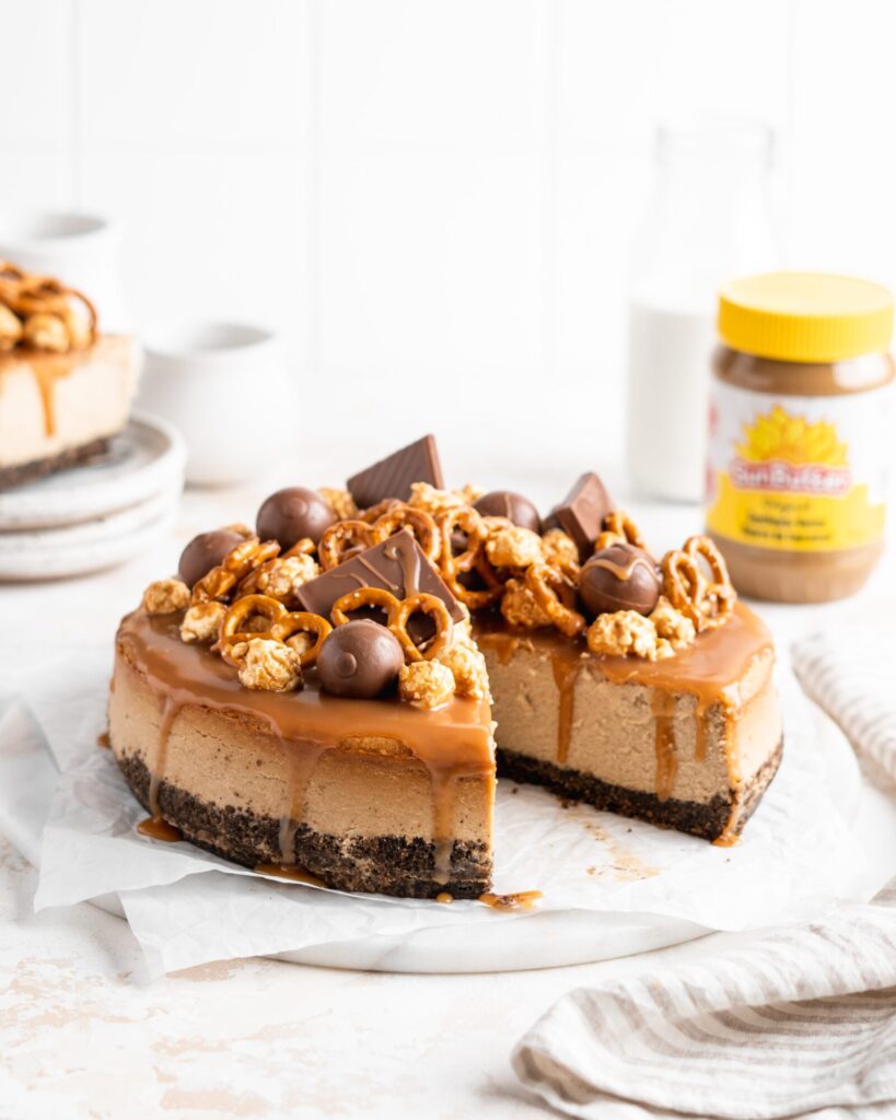 SunButter Cheesecake features a chocolate pretzel crust and is topped with a salted caramel sauce