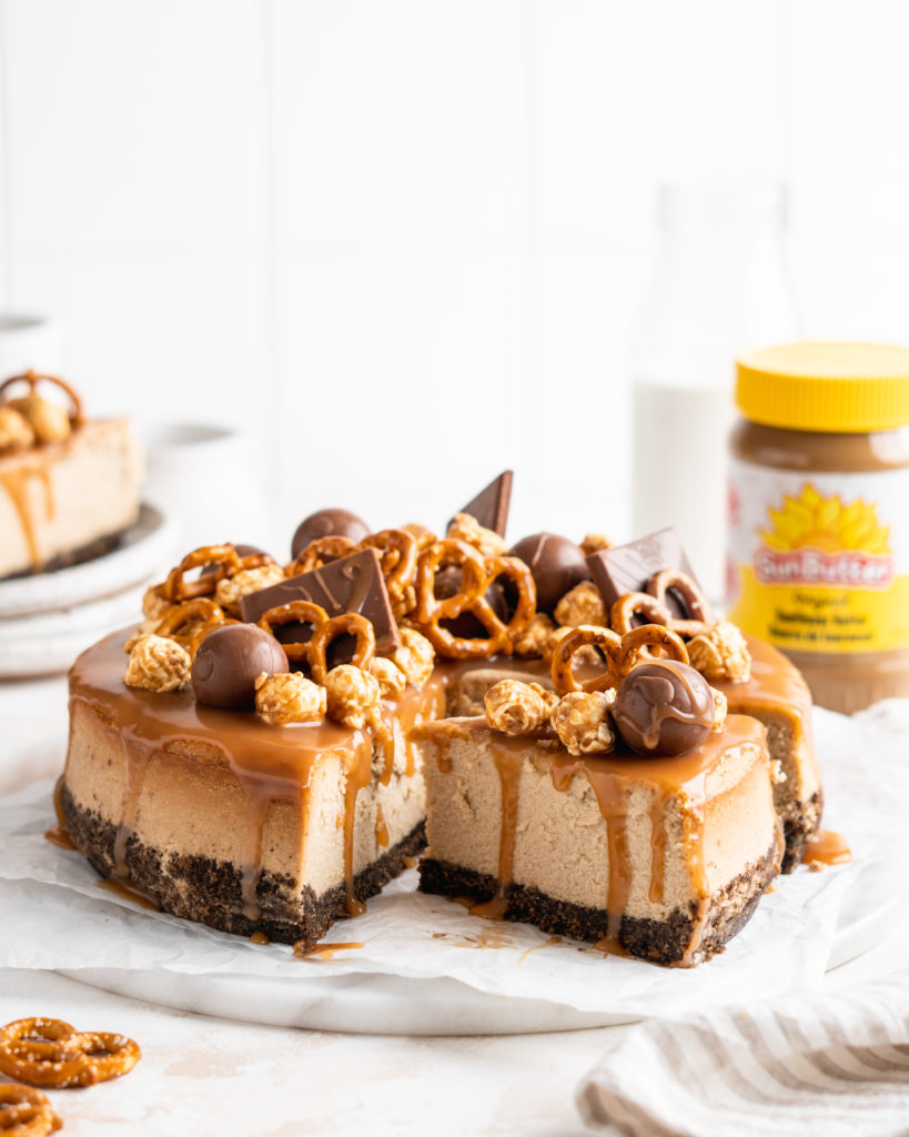 SunButter Cheesecake features a chocolate pretzel crust and is topped with a salted caramel sauce