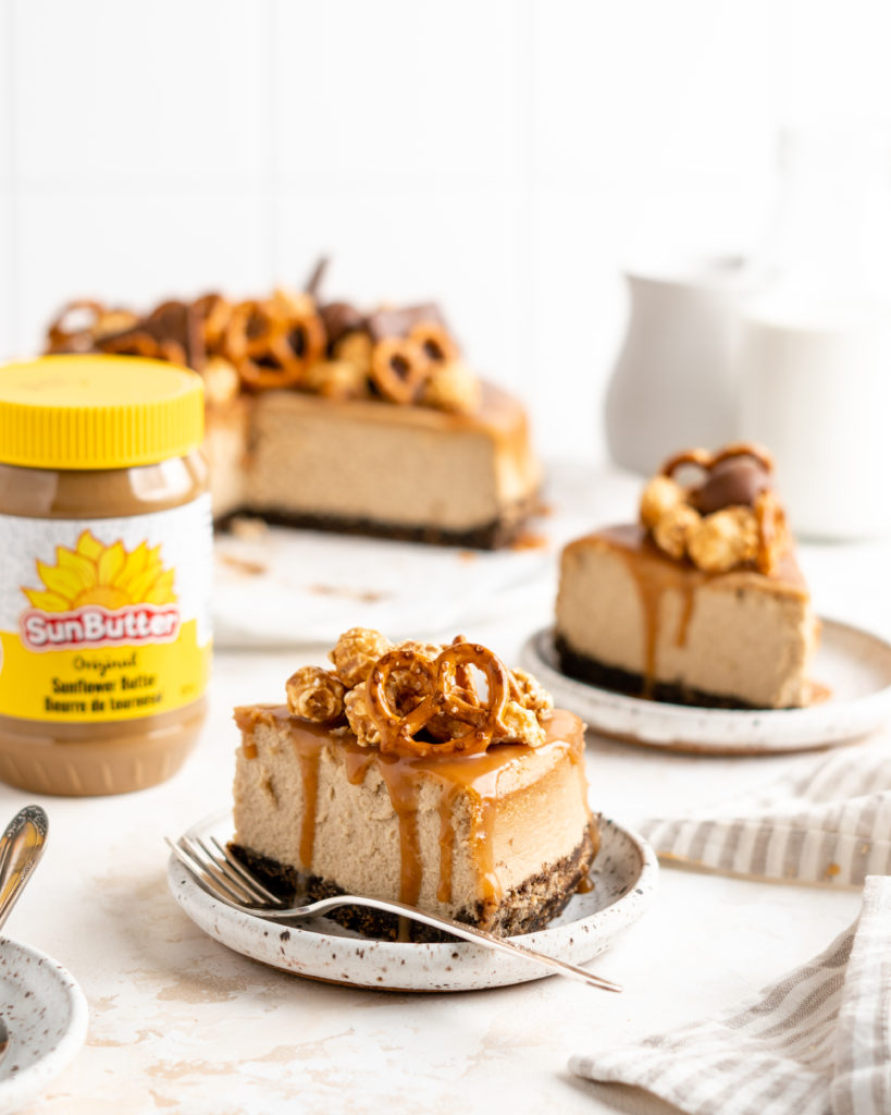 SunButter Cheesecake features a chocolate pretzel crust and is topped with a salted caramel sauce