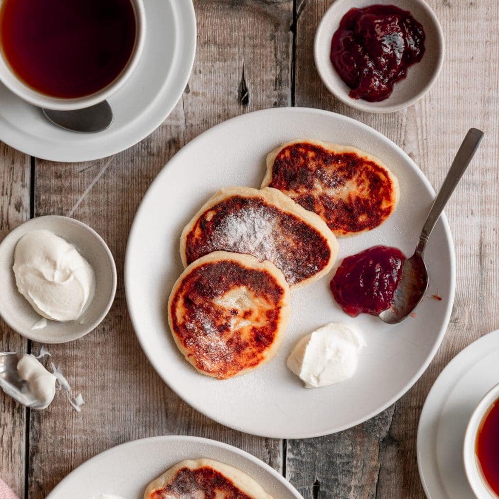 Plate of syrniki with sour cream and jam