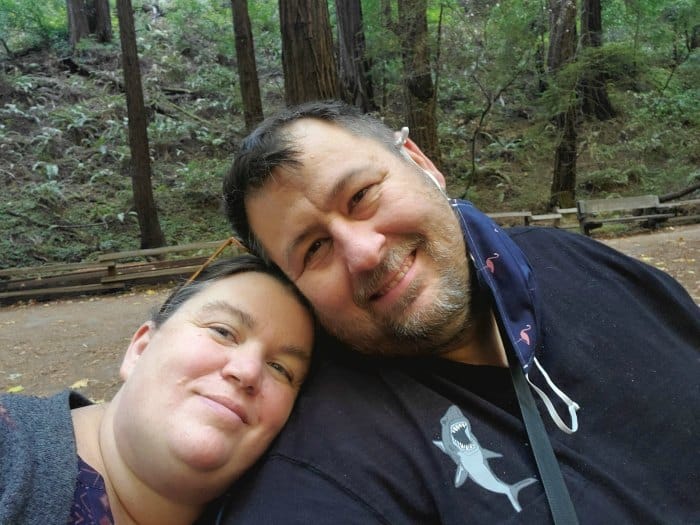 Tammilee and John sitting in Muir Woods