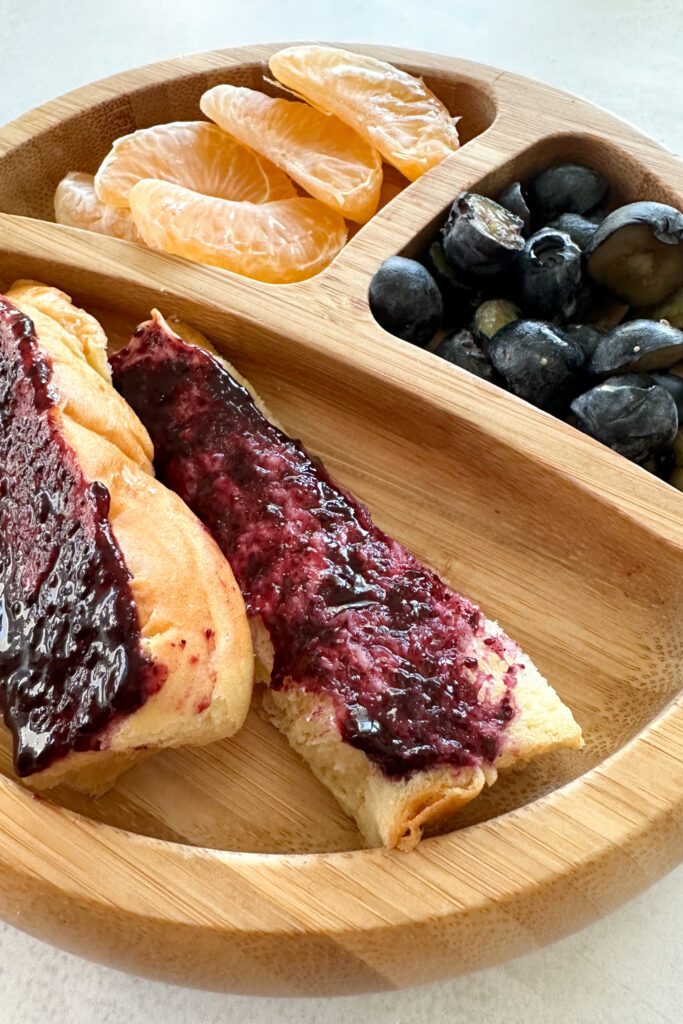 Toast topped with blueberry jam.