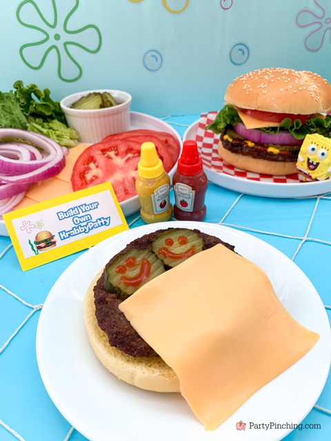 Build your own Krabby Patty, tuck in pickles with cheese on Krabby Patty, ultimate spongebob party, spongebob theme party, best easy spongebob party ideas, cute creative spongebob party ideas, chocolate bars, kelpo cheesecake cups, best spongebob doodle bob cake, chum bucket chum on a stick, sandy's tree dome moon pies