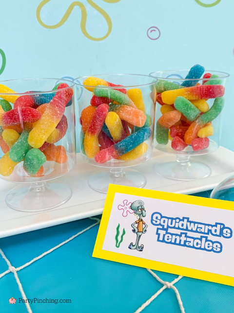 Squidward's Tentacles sour worms, ultimate spongebob party, spongebob theme party, best easy spongebob party ideas, cute creative spongebob party ideas, chocolate bars, kelpo cheesecake cups, best spongebob doodle bob cake, chum bucket chum on a stick, sandy's tree dome moon pies