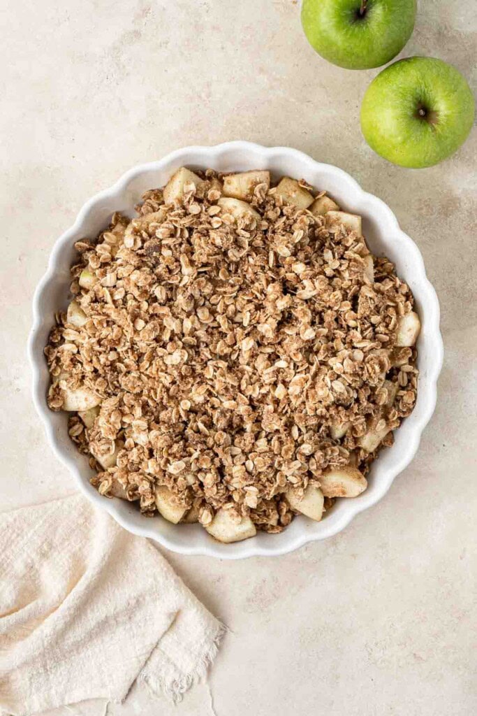 Assembled apple crumble ready for the oven.