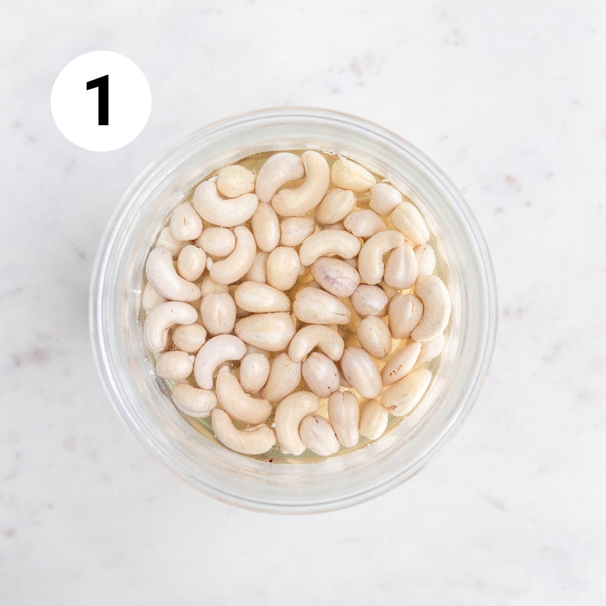 Soaked cashews in a bowl.