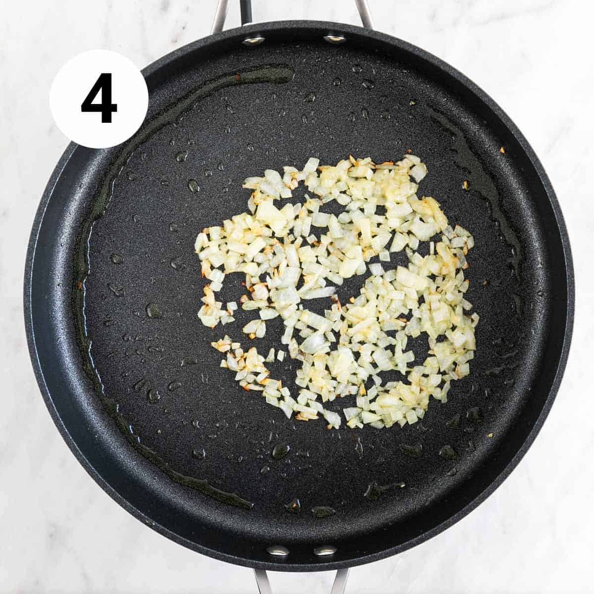 Sautéed onion in a skillet.