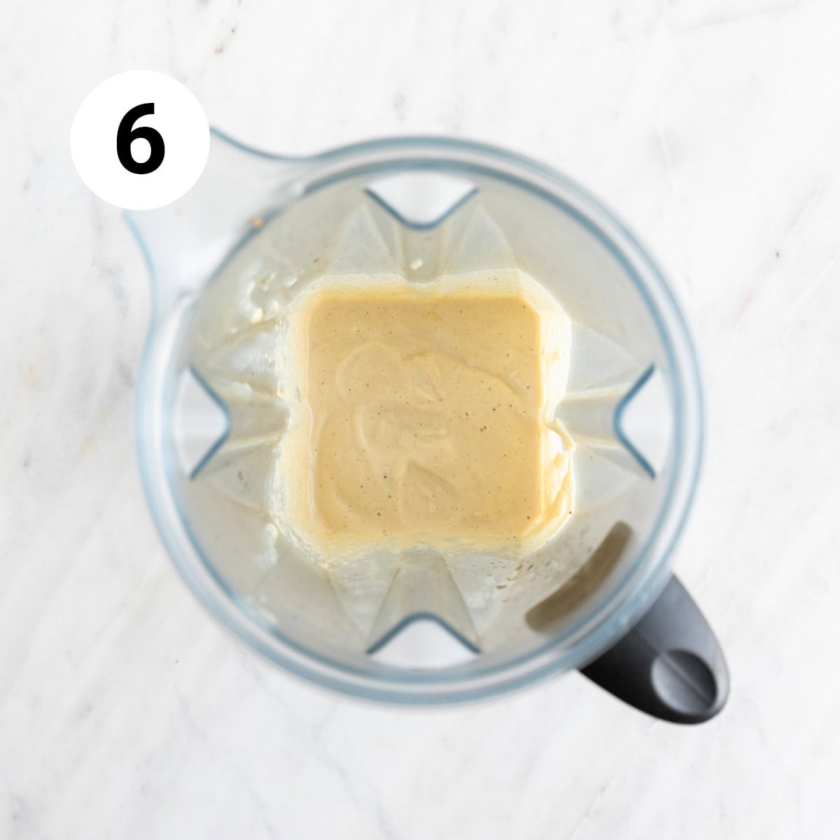   Vegan cashew Alfredo sauce in a blender jar.