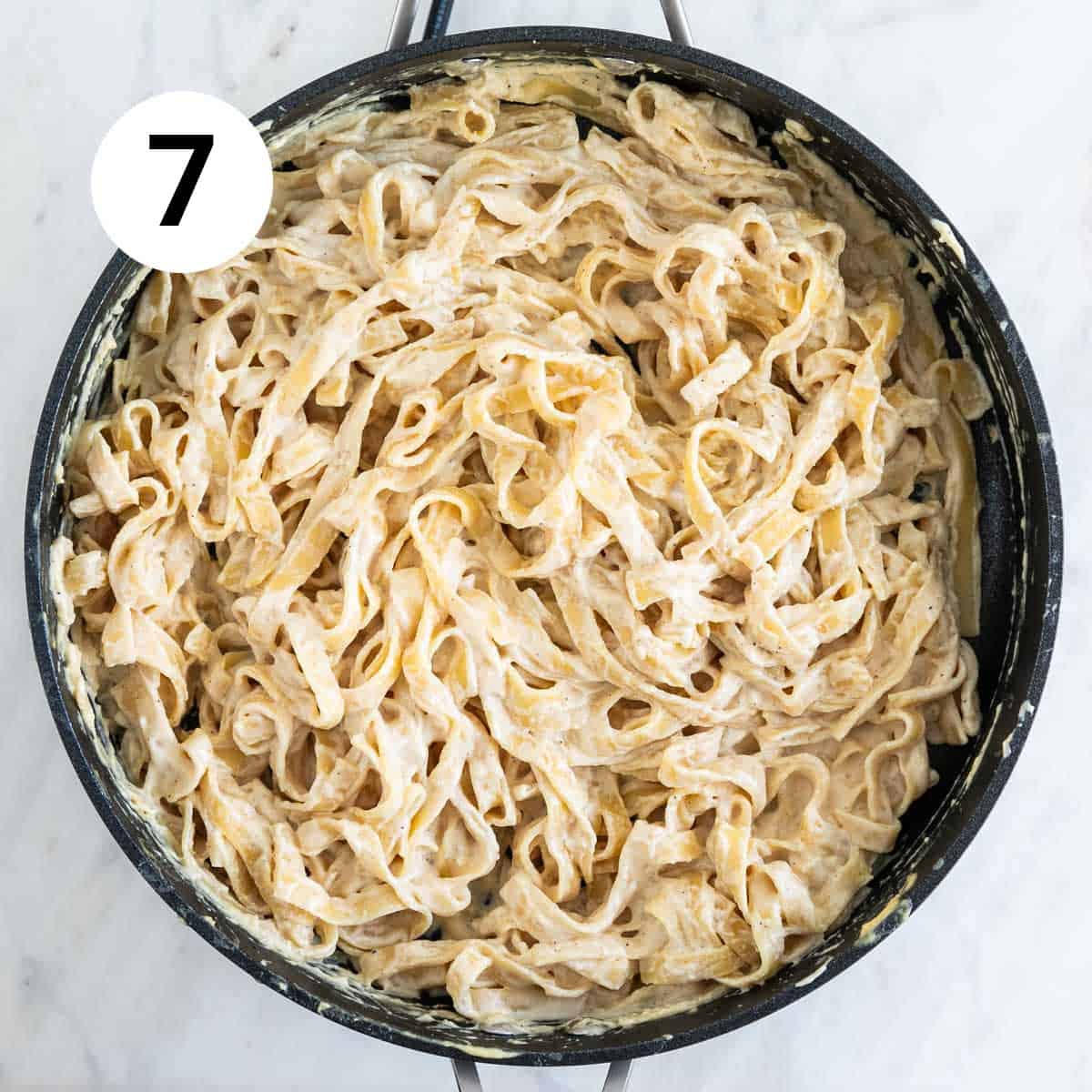 Vegan cashew Alfredo pasta in a skillet.