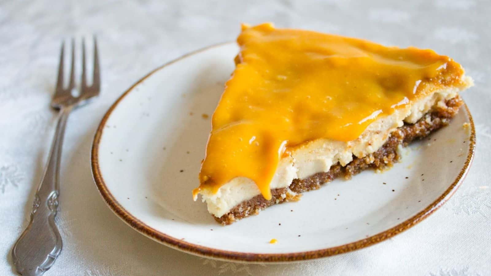 Lemon mango cheesecake slice.