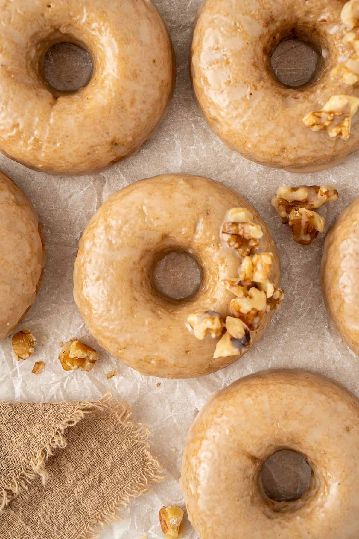 Close up of baked dairy free maple doughnuts.