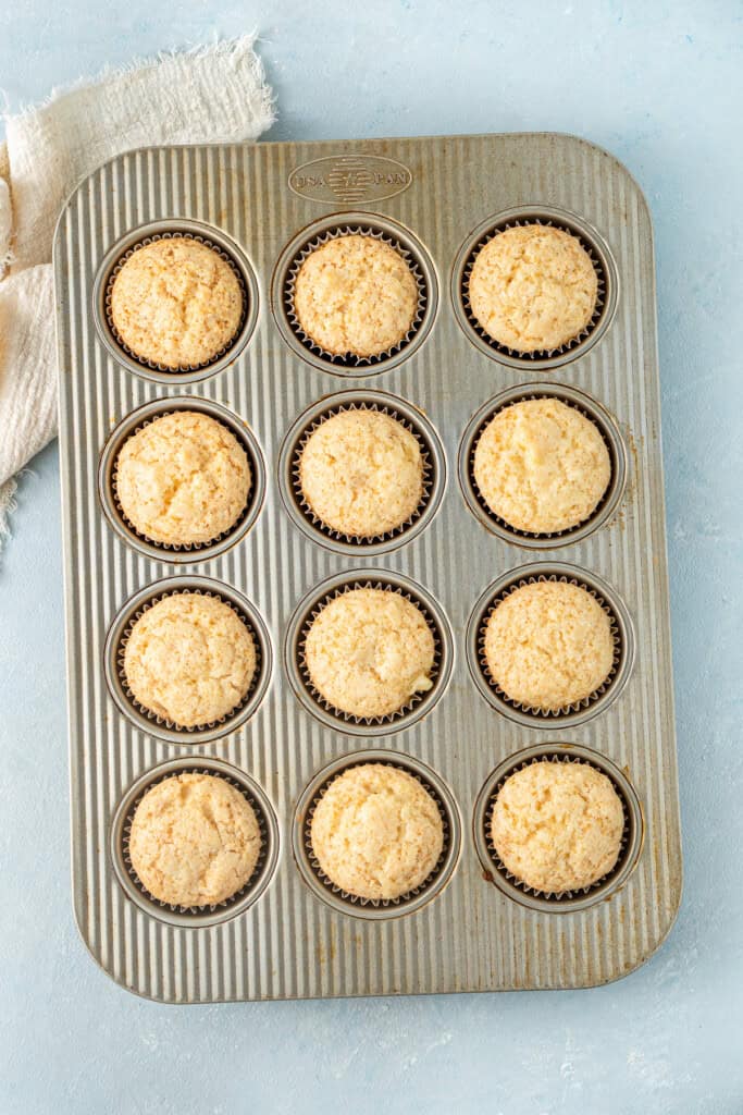 The cupcakes baked in the pan.