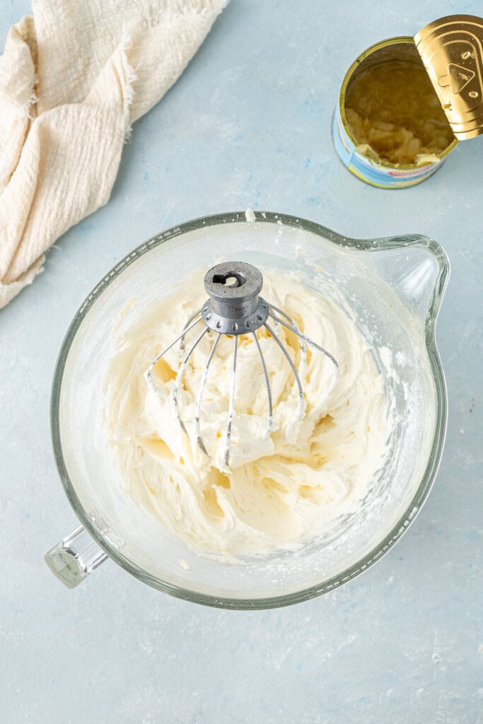 The creamy vegan pineapple buttercream in a bowl.
