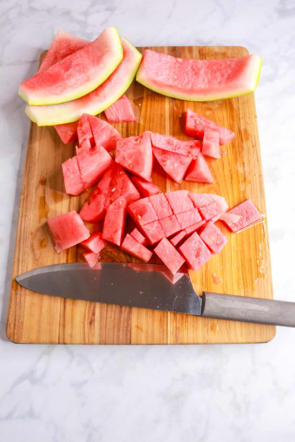 chopped watermelon on a cutting board