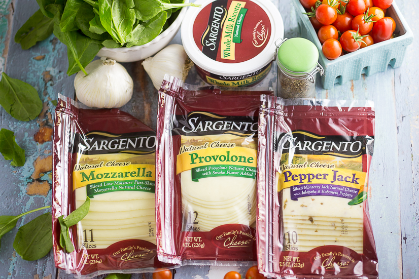 Oven Baked 5 Cheese White Pizza Grilled Cheese Recipe - Baked in the oven to golden, gooey perfection, this deluxe 5 Cheese White Pizza Grilled Cheese is the ultimate cheesy sandwich with 5 types of real cheese, a garlic herb ricotta spread, garlic butter, tangy cherry tomatoes and spinach. 