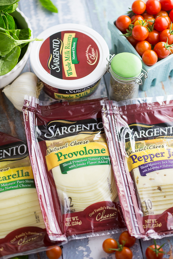 Oven Baked 5 Cheese White Pizza Grilled Cheese Recipe - Baked in the oven to golden, gooey perfection, this deluxe 5 Cheese White Pizza Grilled Cheese is the ultimate cheesy sandwich with 5 types of real cheese, a garlic herb ricotta spread, garlic butter, tangy cherry tomatoes and spinach. 