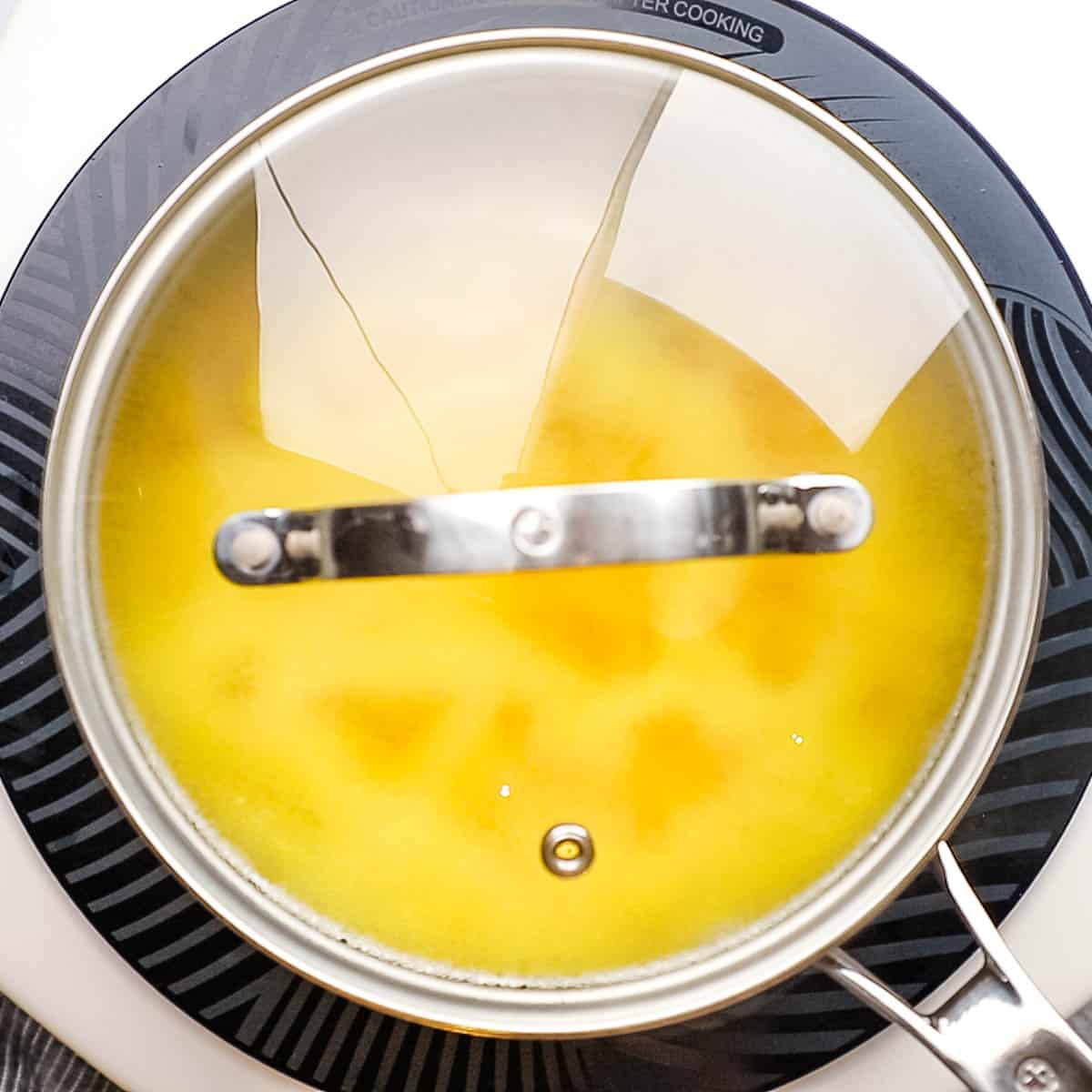 rice being cooked with the lid on