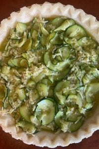 Zucchini Quiche is a great dish year round, but especially when the zucchini is plentiful from the garden or farmers' market. This easy zucchini quiche recipe, made with homemade crust, frozen pie crust or crustless, can be a great breakfast or brunch option.