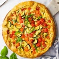 overhead view of a zucchini tomato tart served on a plater