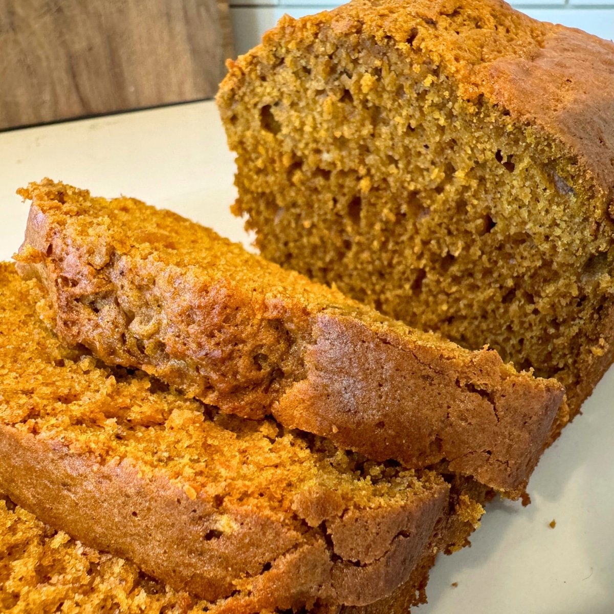 a moist sourdough pumpkin bread loaf sliced