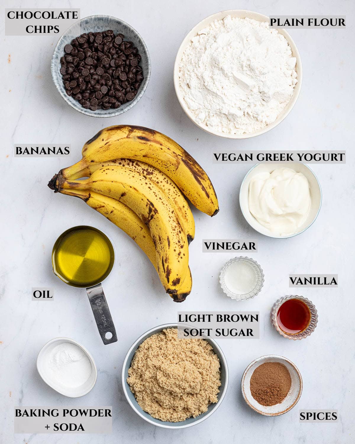 A labelled photo of the ingredients needed to make vegan banana muffins.