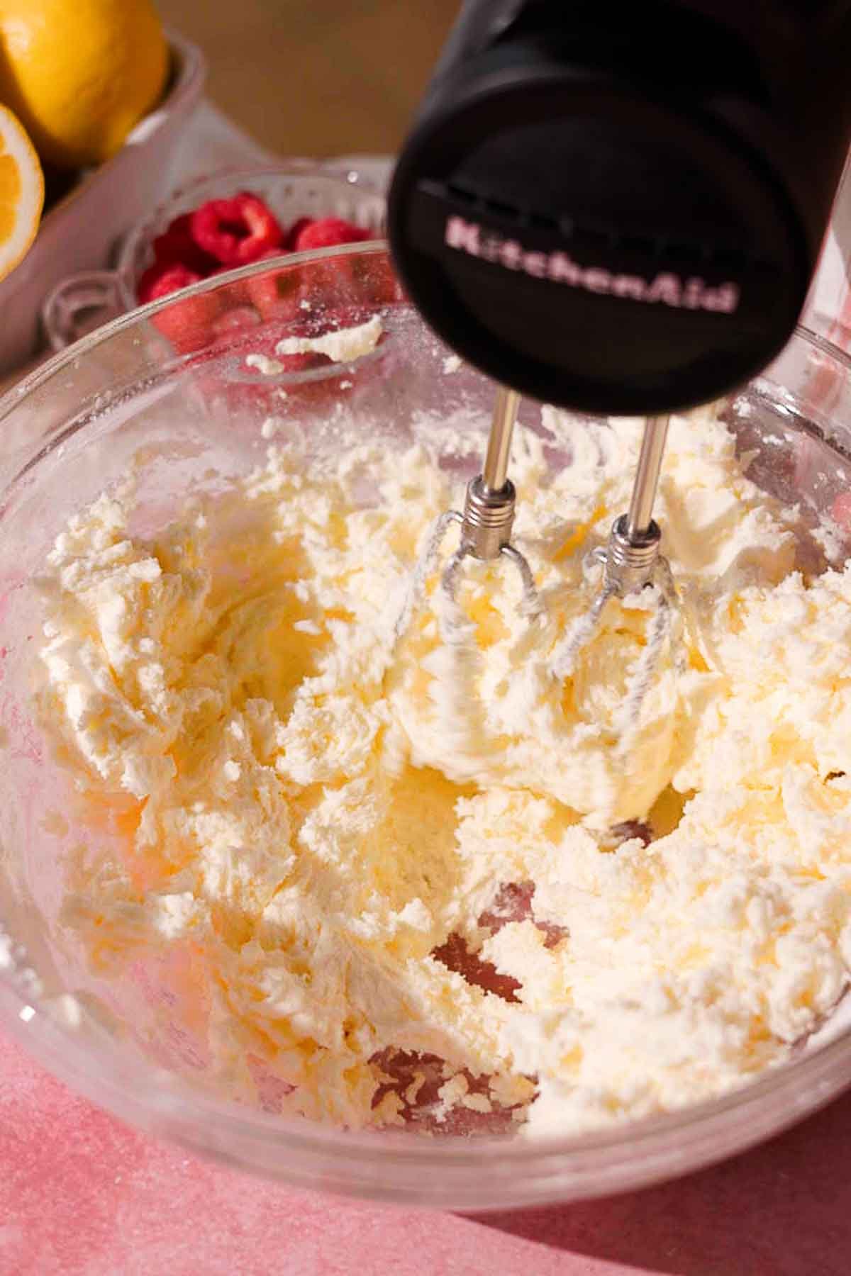 beating butter and powdered sugar together for frosting