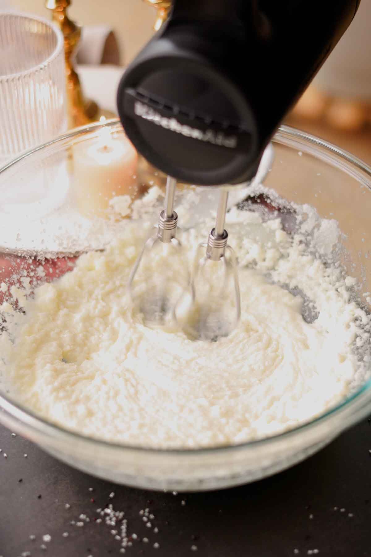 beating butter, oil, and sugar until light and fluffy