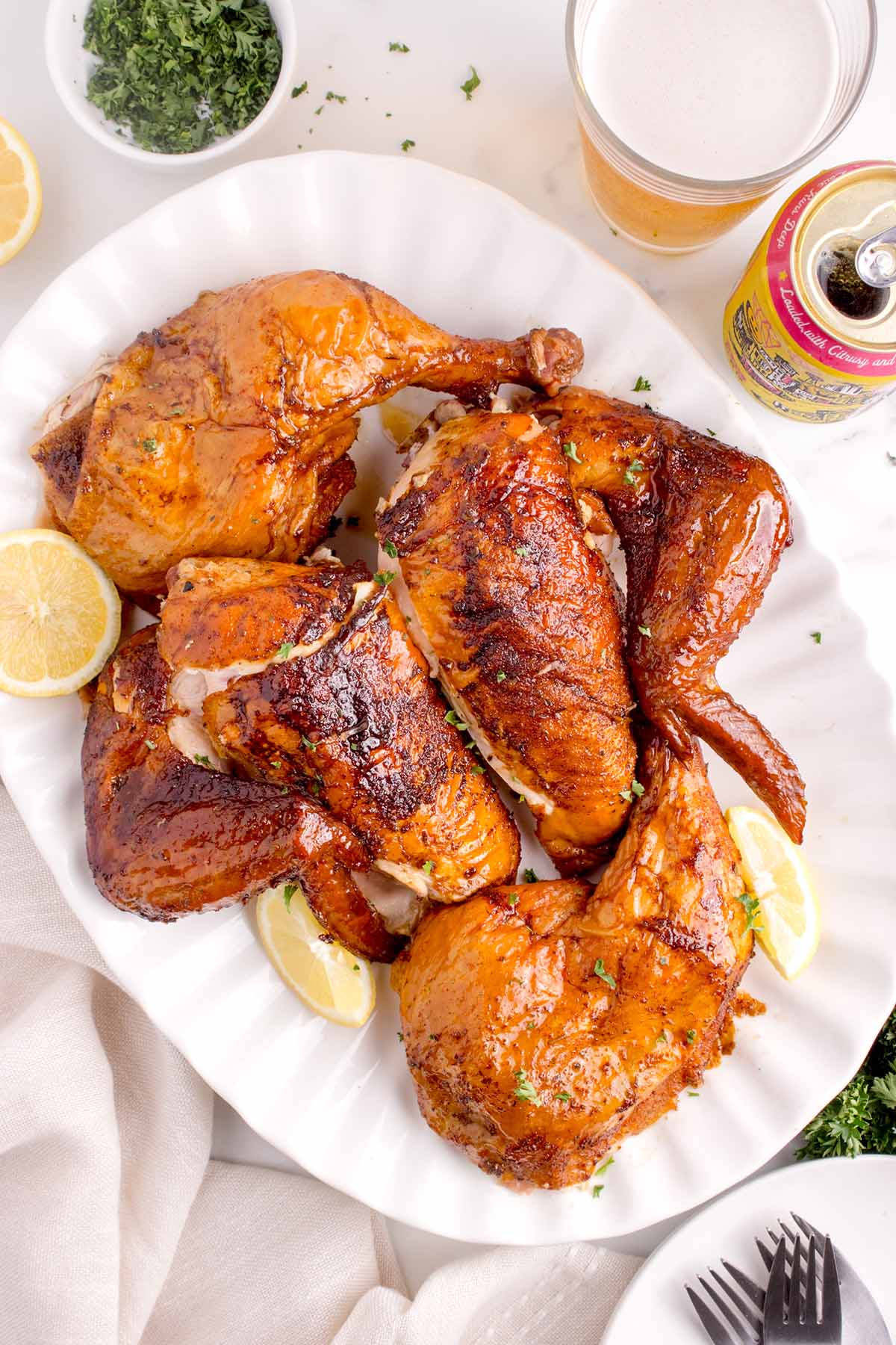 Cooked chicken pieces on a white plate. 