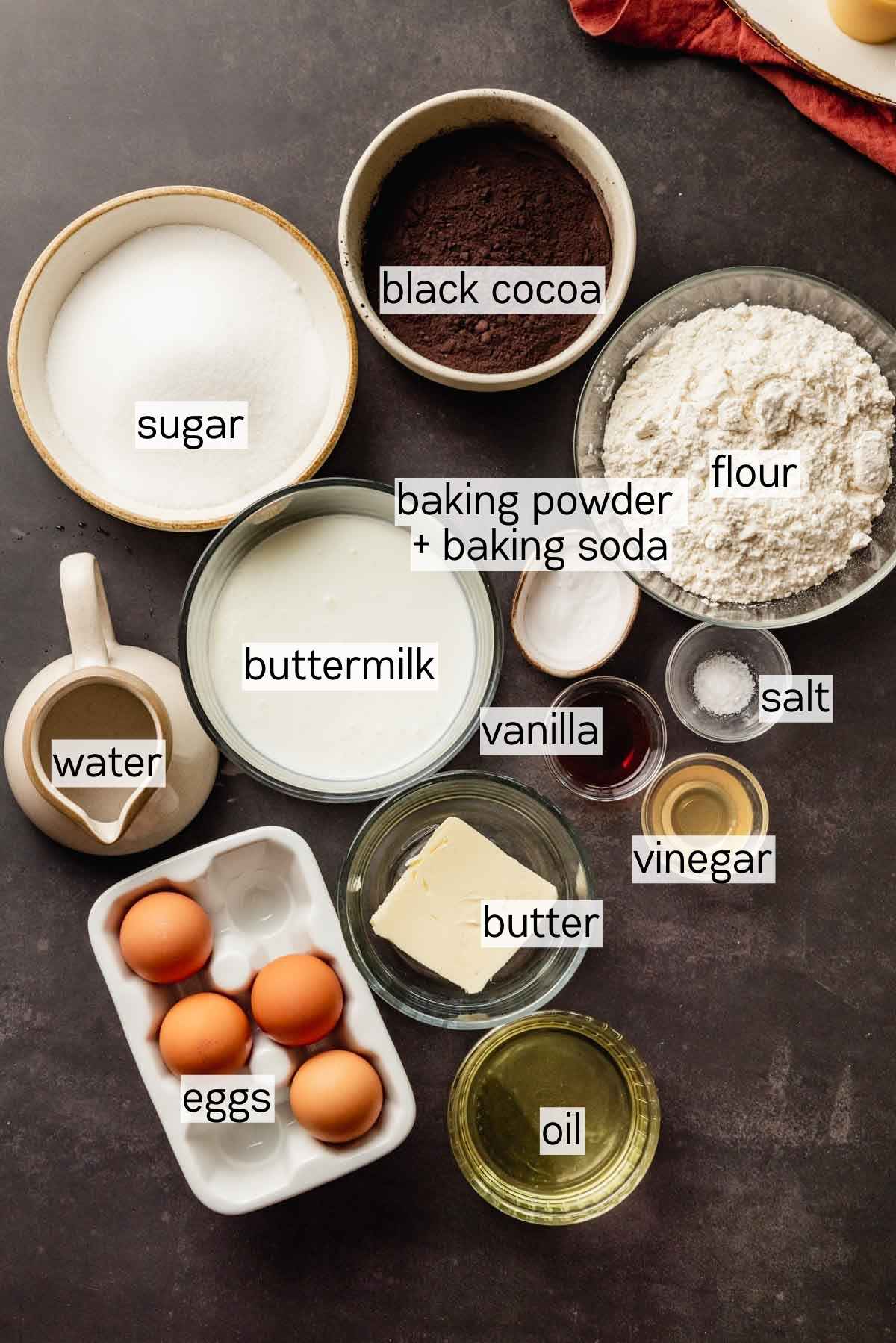 ingredients for black velvet cake layers in bowls
