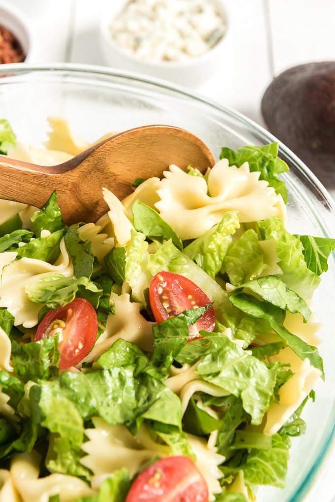 BLT pasta salad mixed with spoon