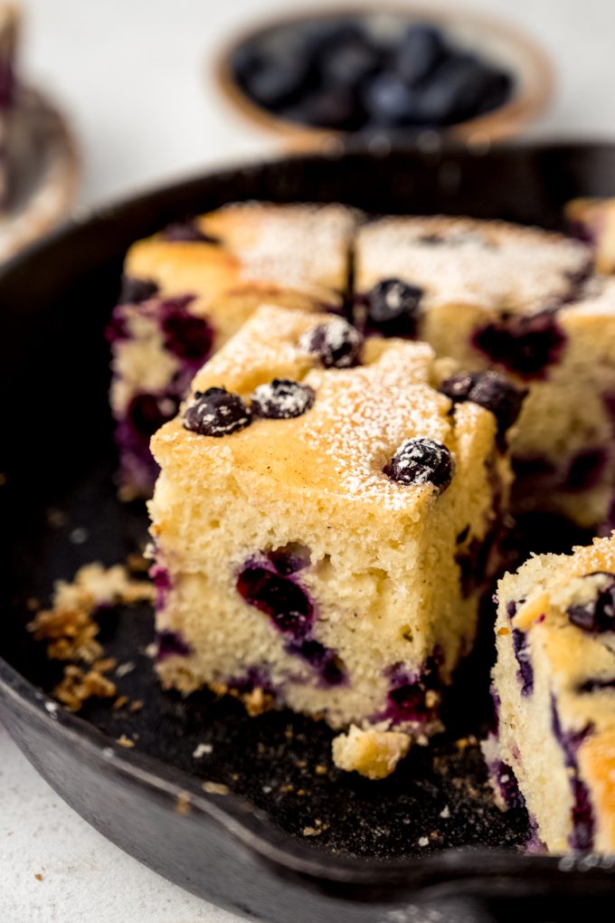 Blueberry cornbread in a cast iron skillet.