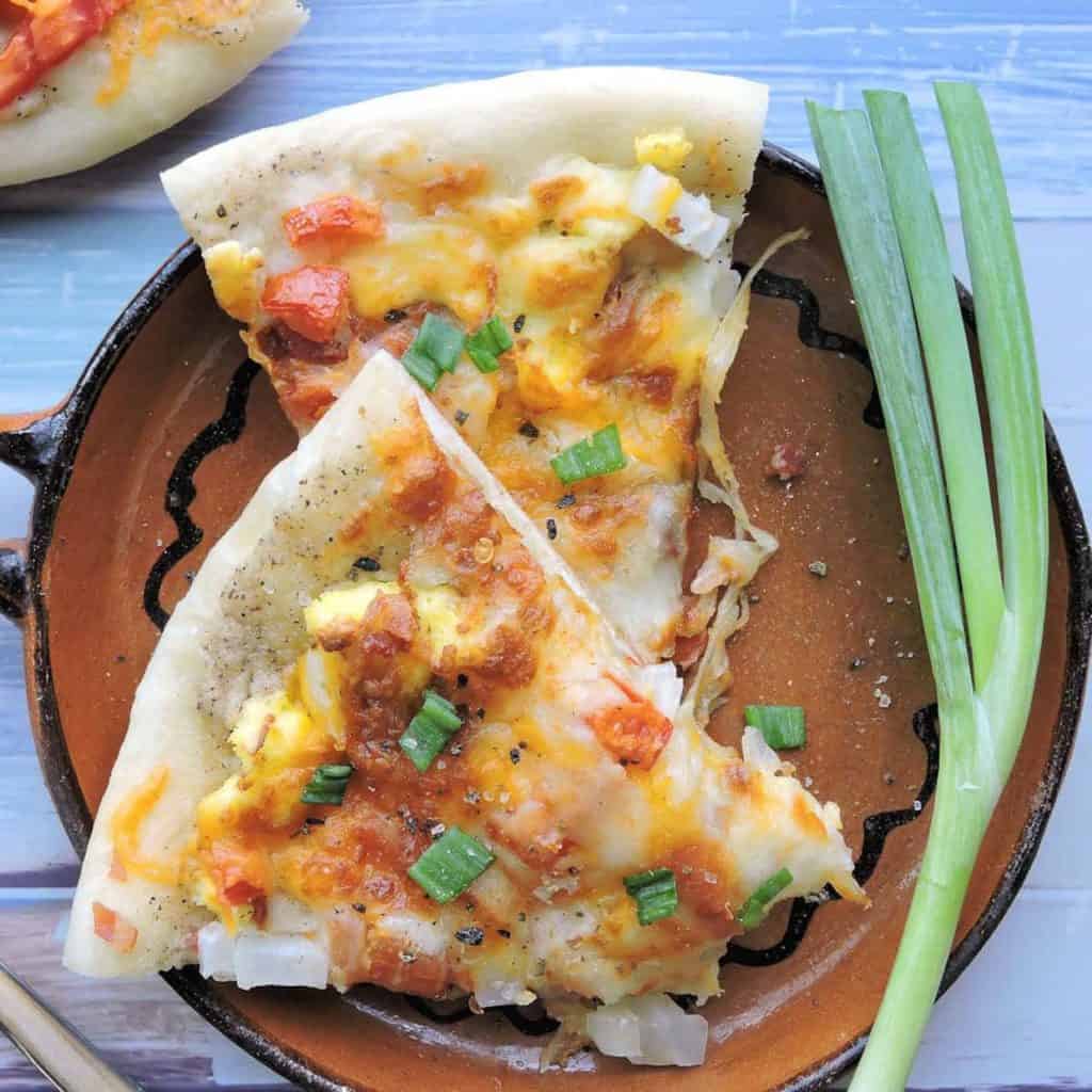 breakfast pizza slices on plate