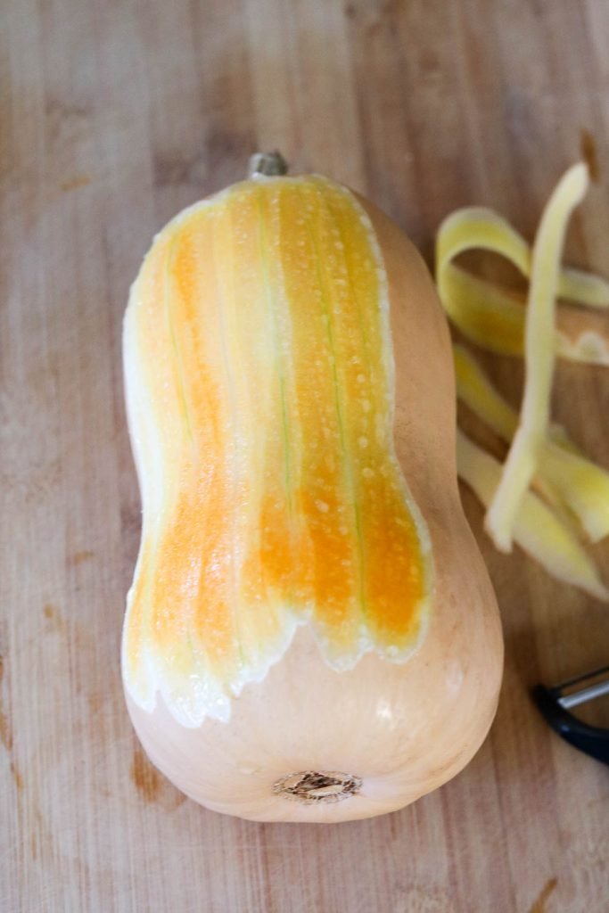 peeling butternut squash for Chicken Schnitzel kale autumn salad 