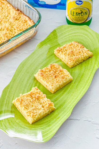 cake mix lemon cream cheese crumb bars on a green platter
