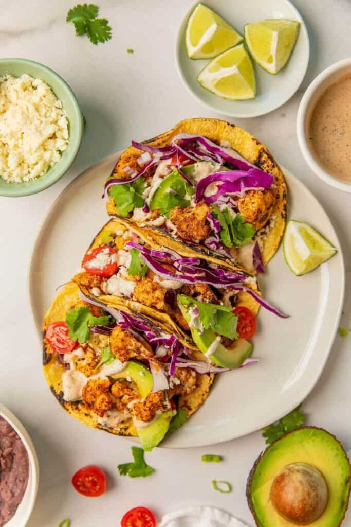 vegetarian cauliflower tacos with yogurt cilantro crema