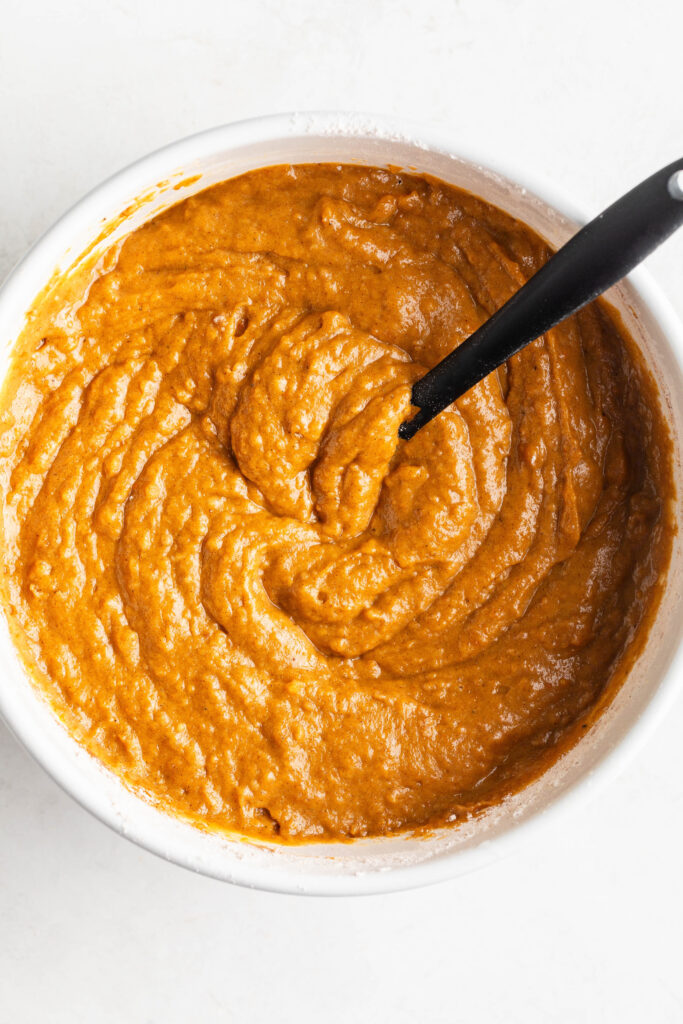 wet and dry chai latte pumpkin spice bread ingredients mixed in a large bowl