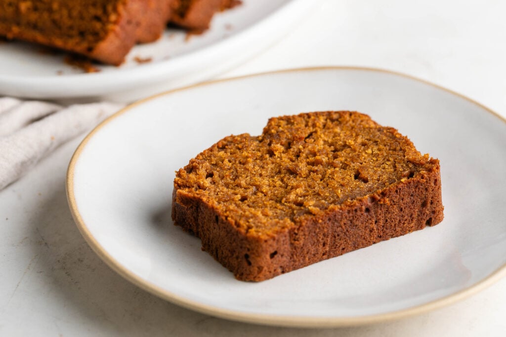 slice of chai latte pumpkin spice bread on a white plate