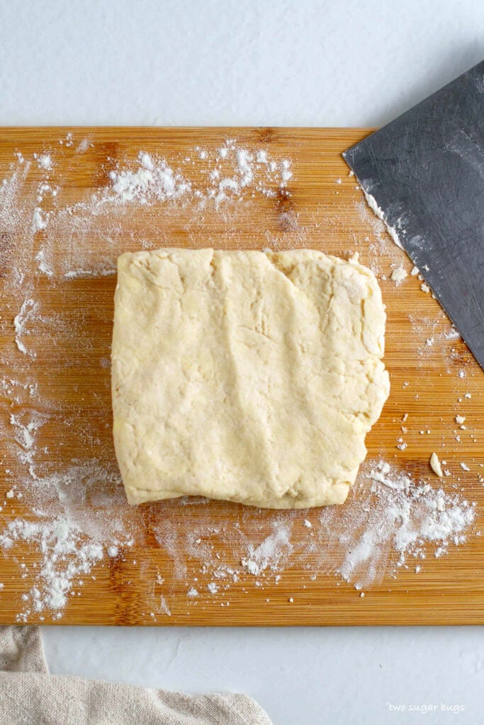 biscuit dough on a cutting board