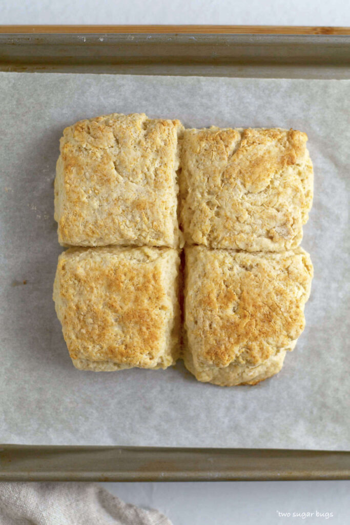 baked vanilla biscuits on parchment lined baking pan