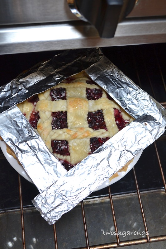 Aluminum foil covering edges of pie 