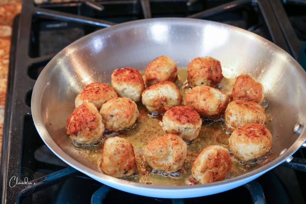 Pan fried meatballs that are done.