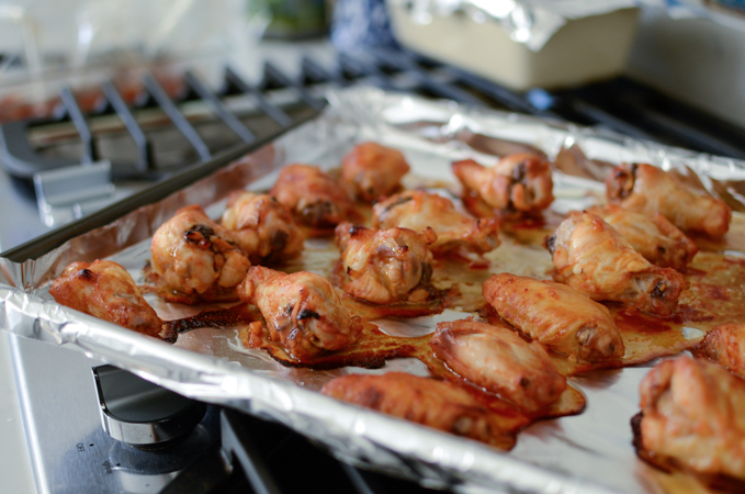 sweet and spicy chicken wings are baked in oven.