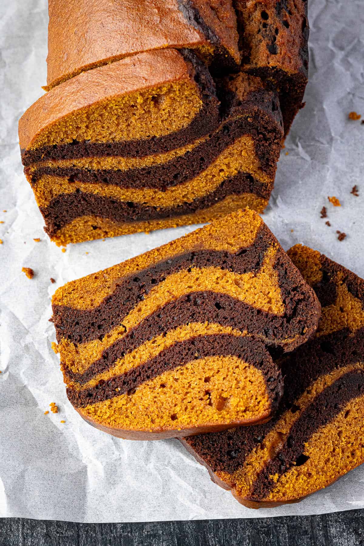 Close up of a slice of vegan chocolate pumpkin marble cake.