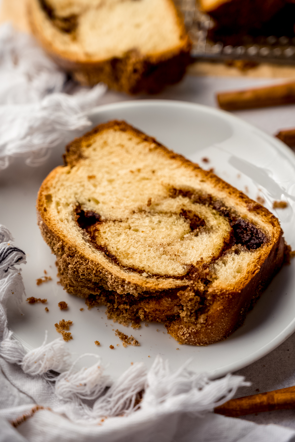 A slice of cinnamon babka on a plate.