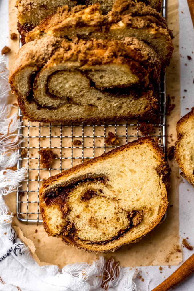 Aerial photo of a loaf of cinnamon babka on wire rack.
