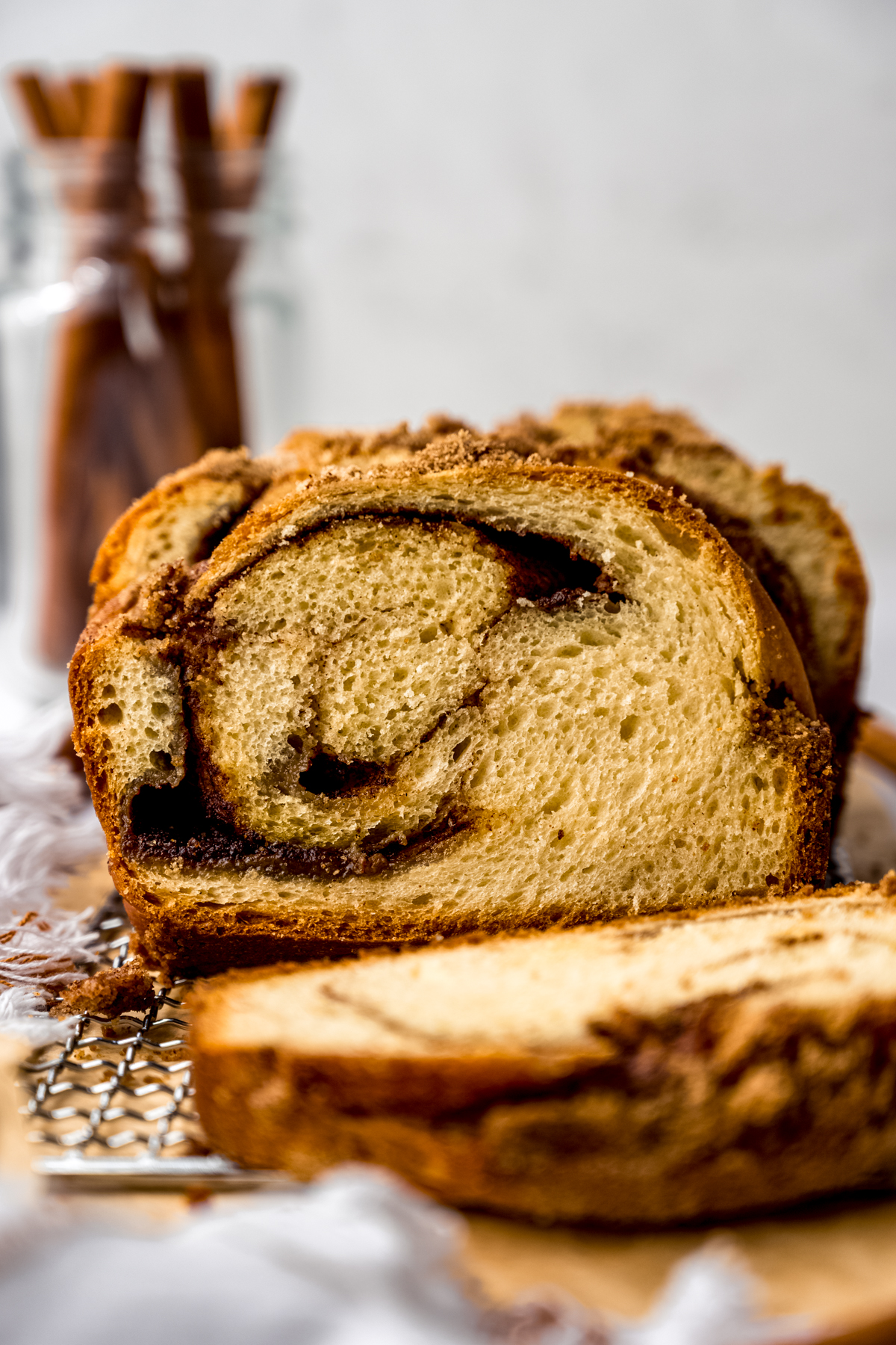 A loaf of cinnamon babka on wire rack.