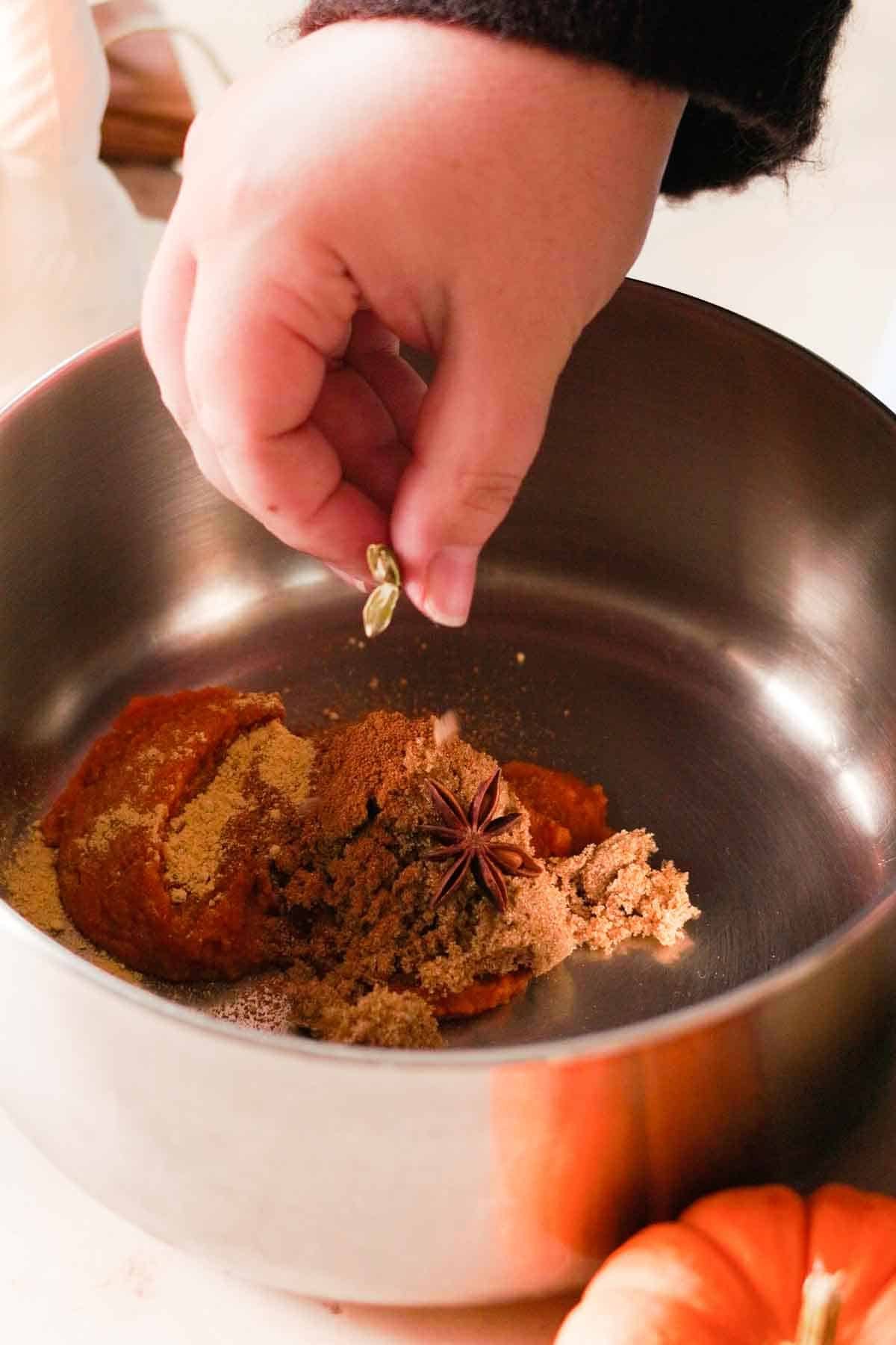 pumpkin spice chai latte spices combined in pot