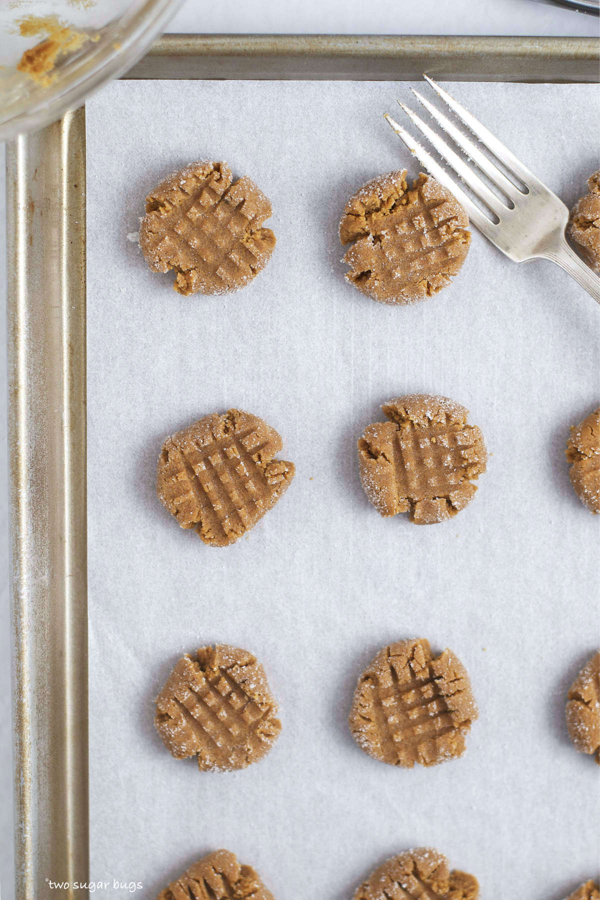 unbaked cookies on a baking sheet