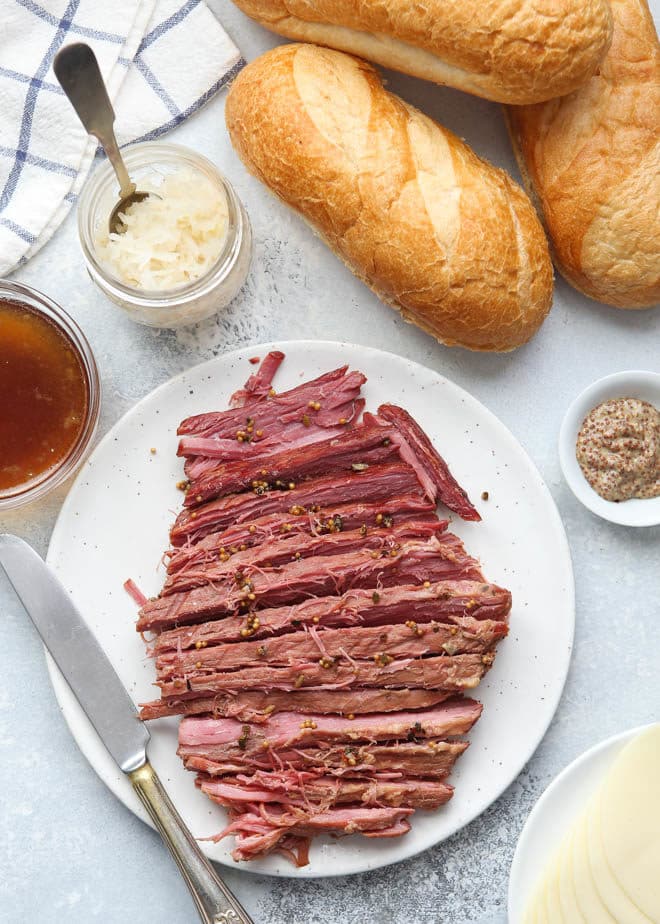 All the fixings for corned beef french dip sandwiches
