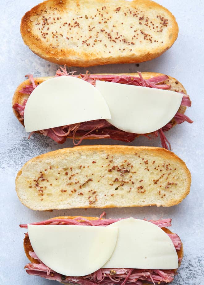 Making corned beef french dip sandwiches